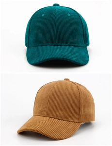 Detail showing the corduroy texture of vintage baseball caps in dark green and caramel colors