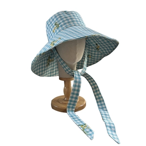 Blue plaid wide brim sun hat with yellow flower embroidery and long chin straps