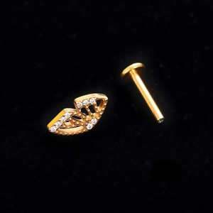 Titanium internally threaded labret stud featuring a gold leaf cluster set with clear zircons