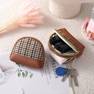 Mini houndstooth canvas coin purse with brown leather trim and zipper closure