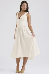 Detail of elegant white V-neck sleeveless corset dress with printed patterns