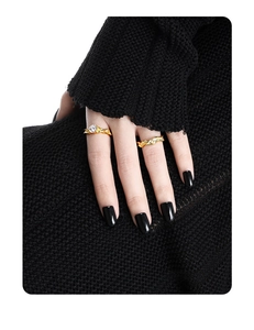 Detail of minimalist gold-plated silver rings with bubble texture and cz stones on model