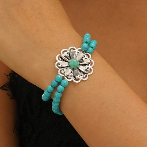 Western turquoise bull head bracelet with silver beads and bohemian floral details