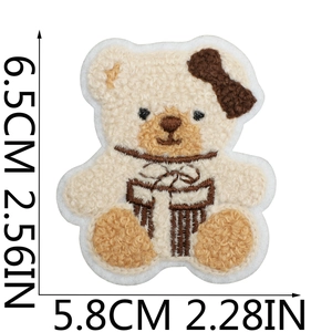 Detail of curly teddy bear embroidery patch with size dimensions 6.5cm by 5.8cm