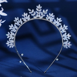 Silver leaf bridal headband with sparkling crystals on dark blue background