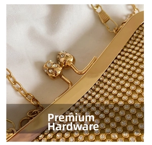 Macro shot of gold rhinestone clutch featuring a crystal ball clasp and fine metal chain