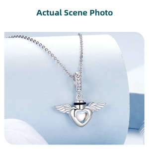 Detailed view of S925 sterling silver heart wings pendant necklace with moonstone