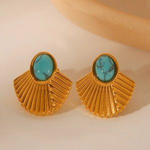 Close-up of vintage gold fan-shaped stud earrings featuring inlaid turquoise stones