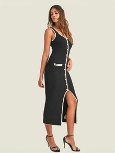 Slim fit black knitted midi dress with white button details and a high side slit