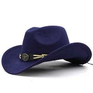Detail of navy blue felt cowboy hat featuring leather band with bull head metal buckle