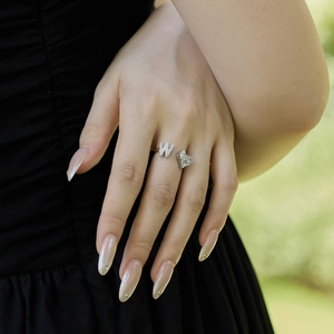 On-hand display of S925 silver ring featuring letter W and heart zircon stone
