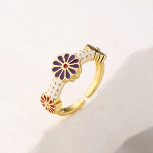Gold-plated enamel flower open ring with purple and blue floral details on a stone base