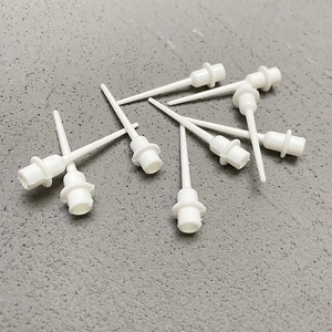 White plastic birthday cake topper base inserts for party decorations on grey background