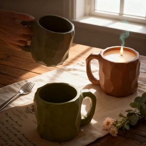 Modern geometric textured ceramic mug for coffee or candles in green and orange tones