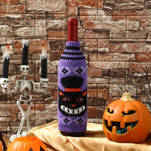 Knitted Halloween wine bottle cover with black cat and hat design for party decor