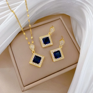 Titanium steel jewelry set featuring deep blue square pendants and necklace with gold finish