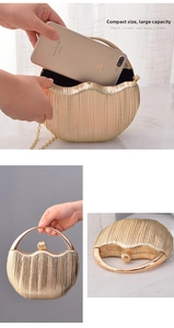 Detail view of golden shell evening clutch with circular handle and chain strap