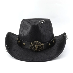 Detail of western cowboy hat with golden bull head buckle and metallic square studs