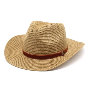 Detail of woven straw texture and velvet ribbon with M logo on the western cowboy hat