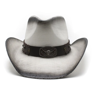 Detail of woven cowboy hat with spray-painted edges and leather band with bull buckle