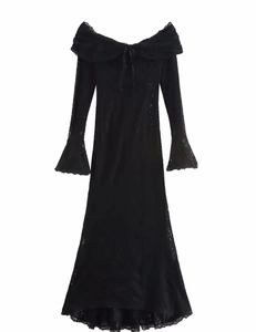 Close-up of black lace dress featuring elegant off-shoulder neckline and flared sleeves