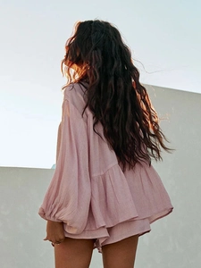 Detail of lavender casual two-piece set featuring ruffle hem blouse and matching shorts