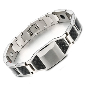 Detailed close-up of men's magnetic bracelet featuring carbon fiber inlays and polished metal