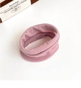 Close-up of a pink velvet high-elastic hair scrunchie on a clean white background