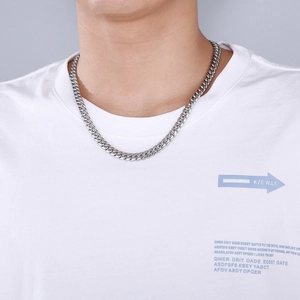 Close-up of 8mm silver stainless steel Cuban link chain necklace worn by a model
