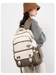 Side view of nylon casual backpack with buckle design and side pocket for water bottle
