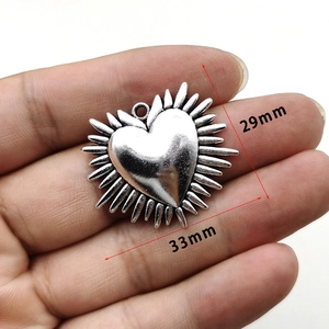 Gothic vintage silver heart pendant with thorn edges, measures 29mm by 33mm