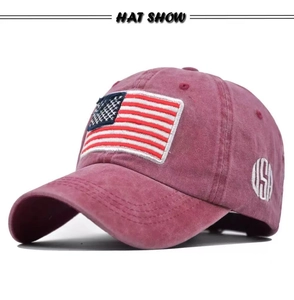 Detail view of burgundy washed cotton baseball cap with 3D embroidery and USA flag patch