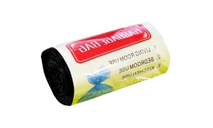 Macro detail of high-density black garbage bag roll with transparent English packaging