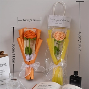 Detail of handmade knitted orange roses in a premium gift bag with size measurements