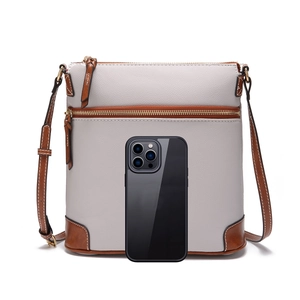 Pebbled leather crossbody bag size comparison with a smartphone showing dimensions
