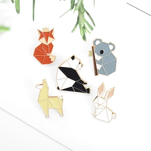 Set of five geometric origami animal enamel pins including fox, panda, and rabbit