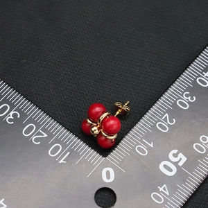 Clover-shaped natural pearl earrings with red beads and 18k gold plating details