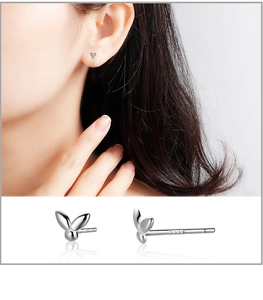 Detail of S999 sterling silver rabbit stud earrings with hallmark and mirror finish
