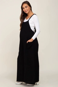 Detail view of maternity black overalls with side pockets and comfy cotton blend fabric