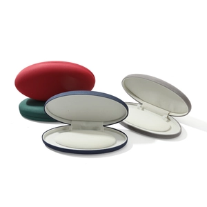 Oval velvet jewelry boxes for necklaces and earrings in four elegant colors with velvet lining