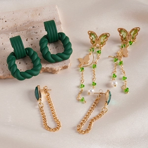 Set of 6 green acrylic butterfly and pearl tassel drop earrings with geometric designs