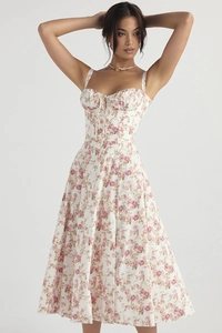 French chic summer strap dress featuring pink floral rose prints on a white base fabric