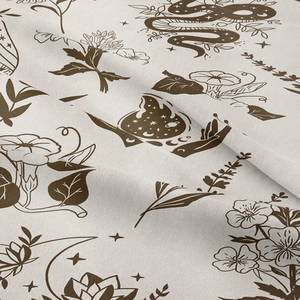 Detail of bohemian tapestry fabric showing snake and mystical celestial patterns