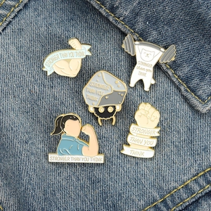 Set of 5 enamel gym lapel pins featuring motivational quotes on blue denim fabric