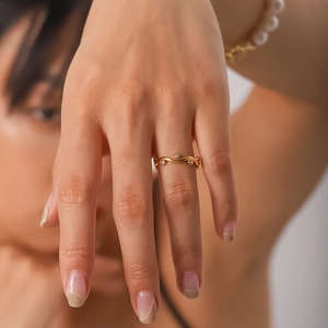 French style 18K gold wave ring with white leaf diamond accents for women on hand