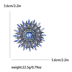 Detailed size view of luxury blue rhinestone sunflower brooch with 5.6cm diameter measurement