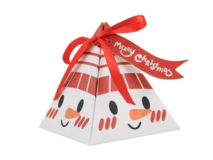 Close-up of snowman pyramid gift box with red bow and Merry Christmas tag
