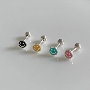 Detail view of four colorful enamel smiley face earrings with secure screw-back design