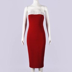 Detail of red tube bodycon dress featuring a white bow accent on the bust and slim fit