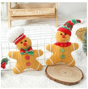 Detail of Christmas gingerbread plush dolls in corduroy fabric for festive home decoration